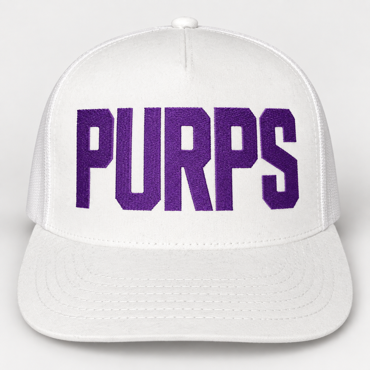 White PURPS snapback hat with tall Niagara purple embroidered block lettering, based on supplied TONKA hat reference; concept mockup