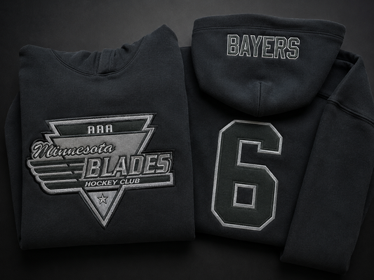 Finished black custom team hoodies with tonal twill applique