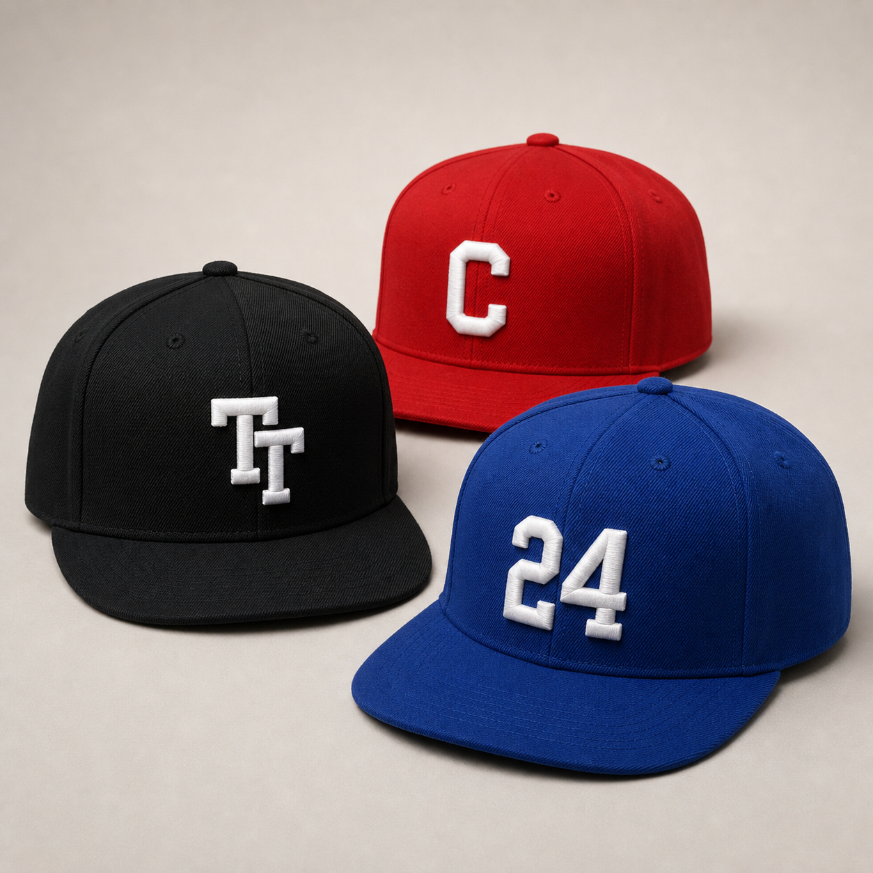 Custom 3D puff embroidered hats in black red and royal blue by TTN Custom Apparel