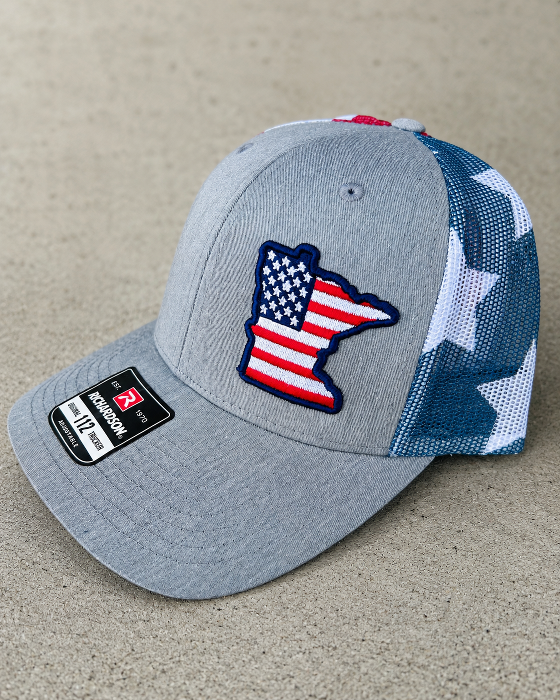 Angled finished custom embroidered trucker hat example